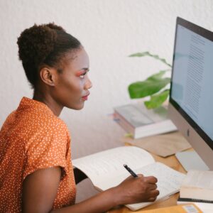 black lady studying with desktop