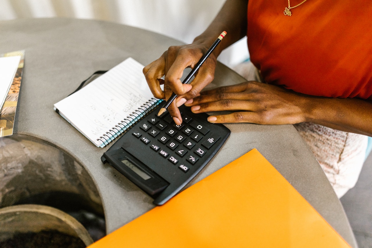 Woman using calculator